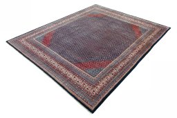 Corner detail of 1970s Sarough rug showing border pattern and Wool pile