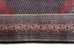 Close-up detail of 1970s Sarough rug from Iran / Persia showing Wool weave