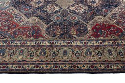 Corner detail of 2000s Sarough rug showing border pattern and Wool pile