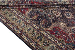 Close-up detail of 2000s Sarough rug from Iran / Persia showing Wool weave