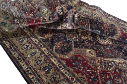 Surface texture of 2000s Sarough rug with natural Wool and intricate pattern