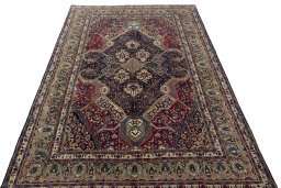 Surface texture of 2000s Sarough rug with natural Wool and intricate pattern