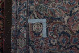 Backside of handmade 1930s Sarough rug showing knot structure and weave density