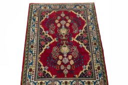 Surface texture of 2000s Sarough rug with natural Wool and intricate pattern