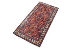 Corner detail of 2000s Sarough rug showing border pattern and Wool pile