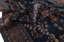 Surface texture of 1930s Sarough rug with natural Cork and intricate pattern