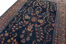 Backside of handmade 1930s Sarough rug showing knot structure and weave density