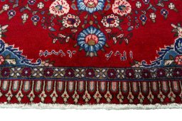 Backside of handmade 2000s Sarough rug showing knot structure and weave density
