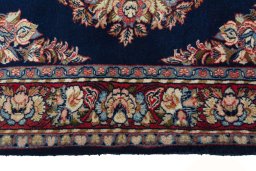 Corner detail of 2000s Sarough rug showing border pattern and Wool pile