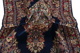Surface texture of 2000s Sarough rug with natural Wool and intricate pattern
