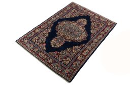 Corner detail of 2000s Sarough rug showing border pattern and Wool pile