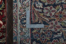 Backside of handmade 1950s Sarough rug showing knot structure and weave density
