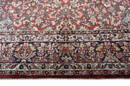 Full view of 1950s Sarough rug from Iran / Persia, 420 × 320 cm in Red tones