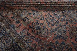 Surface texture of 1930s Sarough rug with natural Cork and intricate pattern