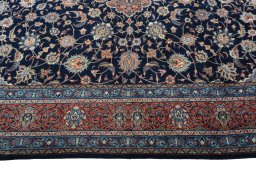 Corner detail of 2000s Sarough rug showing border pattern and Wool pile