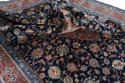 Surface texture of 2000s Sarough rug with natural Wool and intricate pattern
