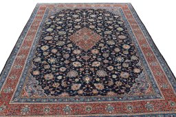 Surface texture of 2000s Sarough rug with natural Wool and intricate pattern