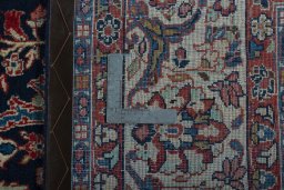 Backside of handmade 1970s Sarough rug showing knot structure and weave density