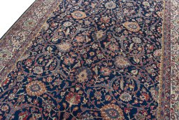 Backside of handmade 1970s Sarough rug showing knot structure and weave density