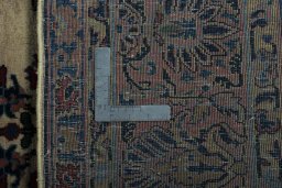 Backside of handmade 1930s Sarough rug showing knot structure and weave density
