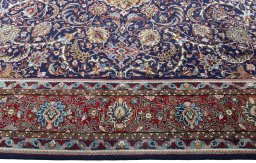 Corner detail of 1970s Sarough rug showing border pattern and Wool pile