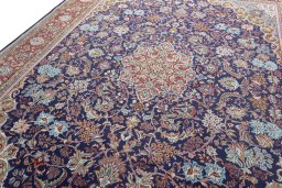 Backside of handmade 1970s Sarough rug showing knot structure and weave density