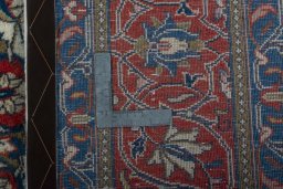 Backside of handmade New Sarough rug showing knot structure and weave density