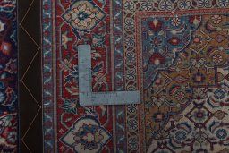 Surface texture of 2000s Sarough rug with natural Cork and intricate pattern