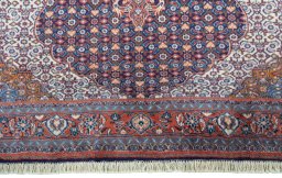Close-up detail of 2000s Sarough rug from Iran / Persia showing Cork weave