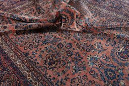 Surface texture of 1930s Sarough rug with natural Cork and intricate pattern