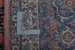 Backside of handmade 1930s Sarough rug showing knot structure and weave density