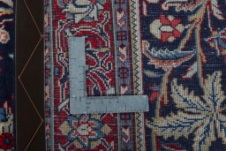 Backside of handmade New Sarough rug showing knot structure and weave density