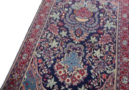 Backside of handmade New Sarough rug showing knot structure and weave density