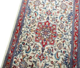 Backside of handmade New Sarough rug showing knot structure and weave density