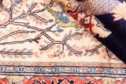 Corner detail of 2000s Sarough rug showing border pattern and Wool pile