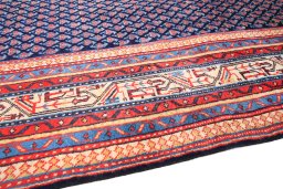 Backside of handmade 1990s Sarough rug showing knot structure and weave density