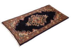 Corner detail of 1990s Sarough rug showing border pattern and Wool pile