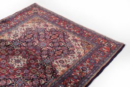 Surface texture of 1990s Sarough rug with natural Wool and intricate pattern