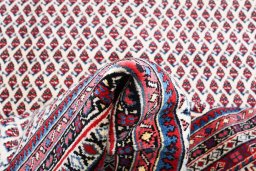 Corner detail of 2000s Sarough Mir rug showing border pattern and Wool pile