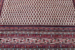 Backside of handmade 2000s Sarough Mir rug showing knot structure and weave density