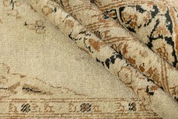 Corner detail of 1900s Tabriz rug showing border pattern and Wool pile