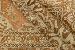 Corner detail of 1900s Tabriz rug showing border pattern and Wool pile