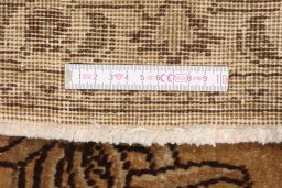 Corner detail of 1950s Tabriz rug showing border pattern and Wool pile