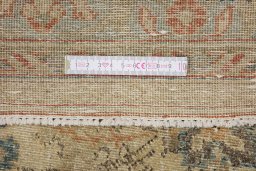 Corner detail of 1900s Tabriz rug showing border pattern and Wool pile