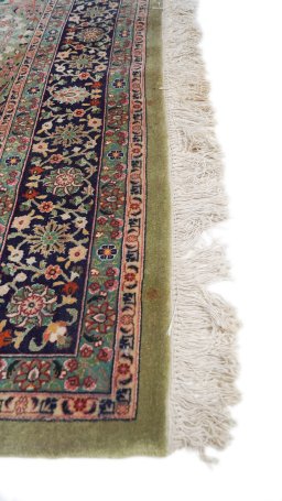 Corner detail of 1980s Tabriz rug showing border pattern and Wool pile