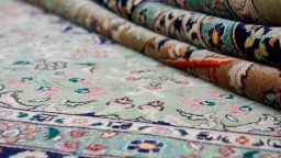 Close-up detail of 1980s Tabriz rug from Iran / Persia showing Wool weave