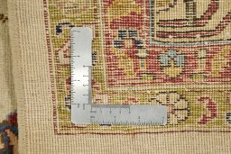 Close-up detail of 1920s Tabriz rug from Iran / Persia showing Wool weave