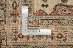 Corner detail of 1900s Tabriz rug showing border pattern and Wool pile