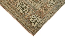 Surface texture of 1900s Tabriz rug with natural Wool and intricate pattern