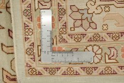 Corner detail of New Tabriz rug showing border pattern and Wool pile